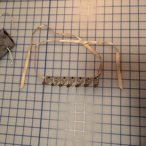 Elegant Gold Ribbon Necklace